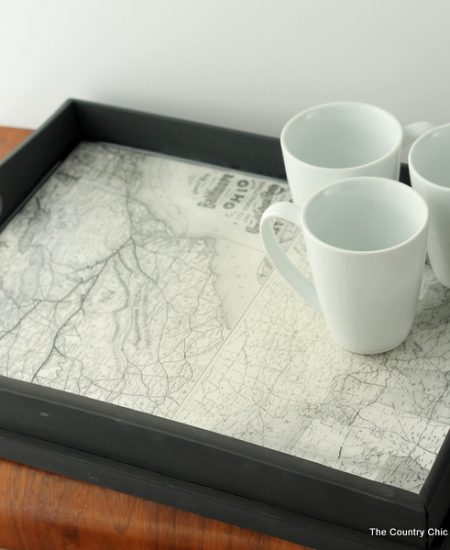 Make this vintage map tray including pouring epoxy to make a glass like surface.