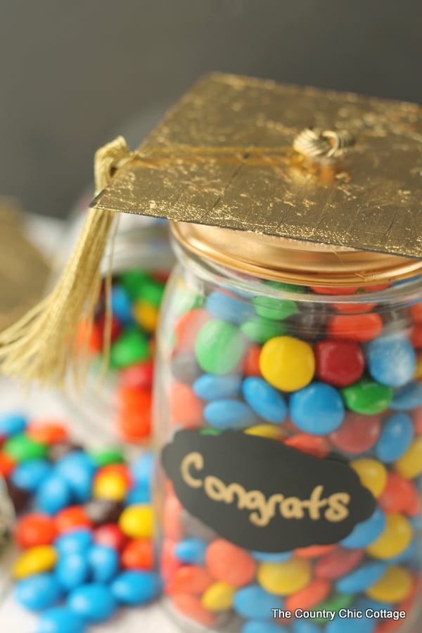 Close up of gold leaf on graduation cap lid.