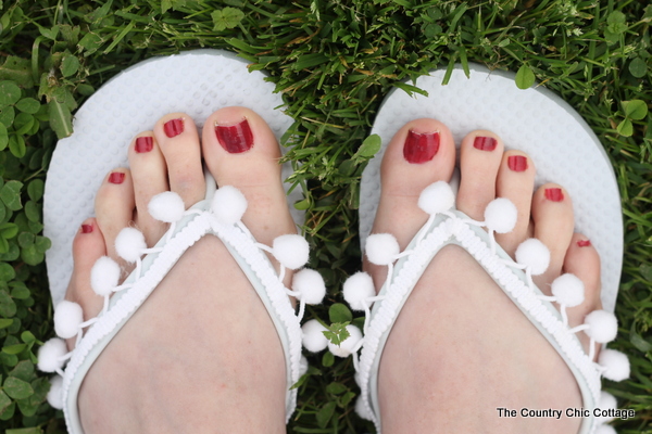 Pom Pom Fringe Flip Flops -- add fringe to a cheap pair of flip flops for an awesome summer fashion accessory!  