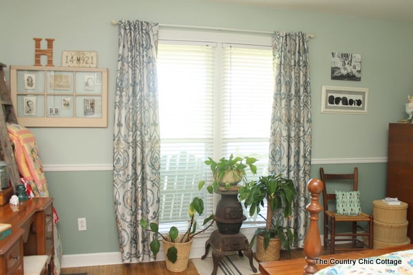 window with new window treatments and plants in front
