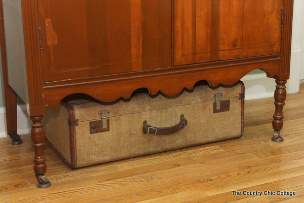 antique suitcases under the dresser