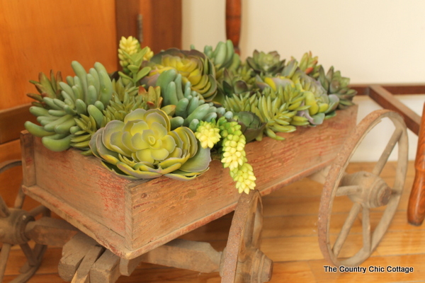 Gorgeous foyer makeover with a chair from Sauder furniture.  Love the rustic farmhouse details!