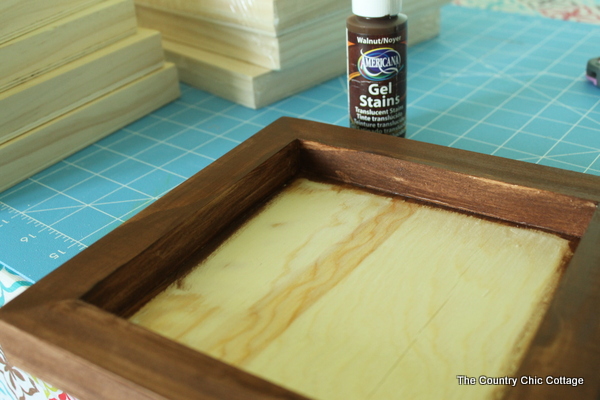 wood panel frame and bottle of paint stain