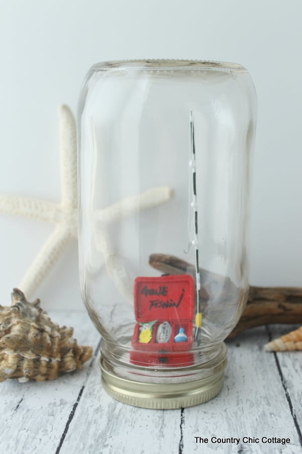 Beach mason jar with a gone fishin' sign inside