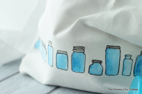 tote with colored jar images