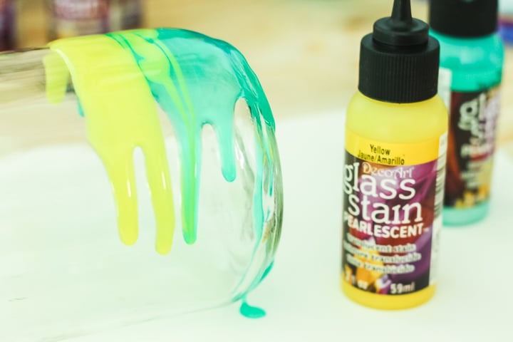 pouring glass stain on a clean jar