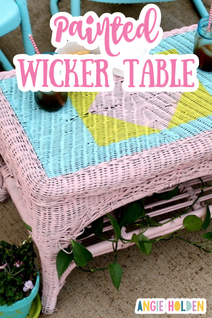 painted wicker table with pink, blue and yellow paint