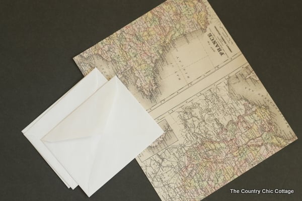 A full-size printed map of France and 2 white envelopes 