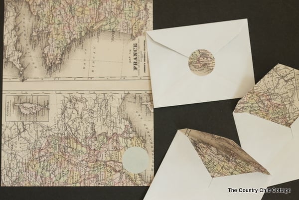 2 Envelopes with maps inside of them