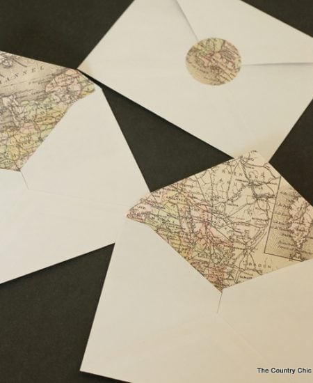 An awesome method for making map lined envelopes the easy way! The map lining and matching seals are a free printable! Great for weddings or any invitations!