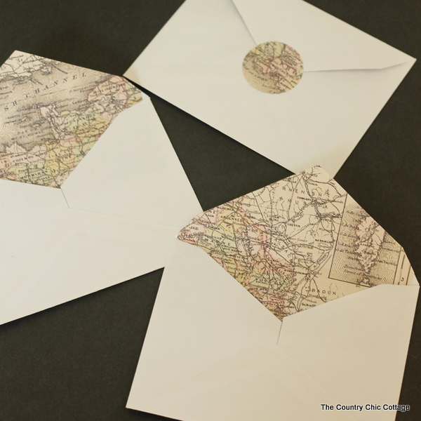 An awesome method for making map lined envelopes the easy way!  The map lining and matching seals are a free printable!  Great for weddings or any invitations!