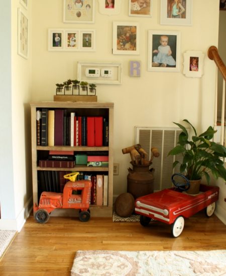 Farmhouse style bookshelf in a foyer that you really must see! Click to get all of the details!