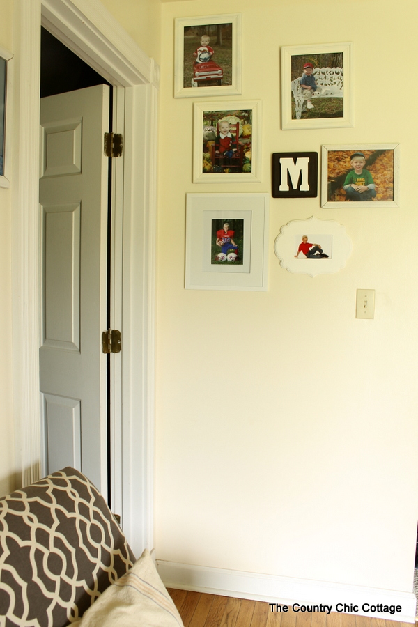 Farmhouse style bookshelf in a foyer that you really must see!  Click to get all of the details!