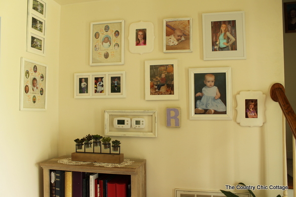 Farmhouse style bookshelf in a foyer that you really must see!  Click to get all of the details!