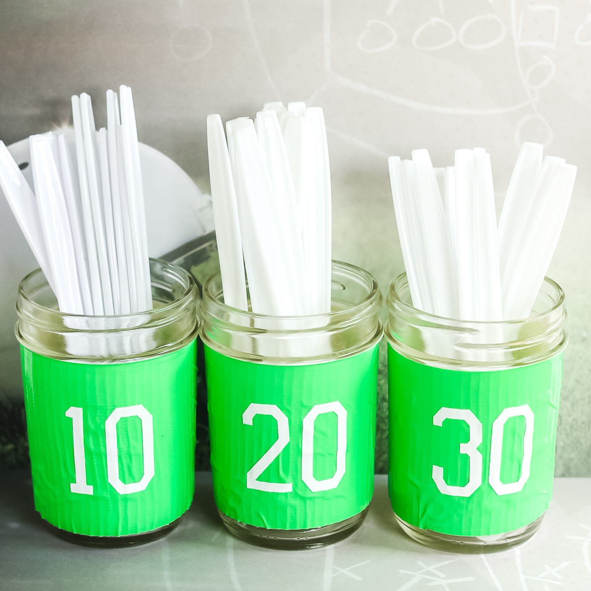 green mason jars with football numbers