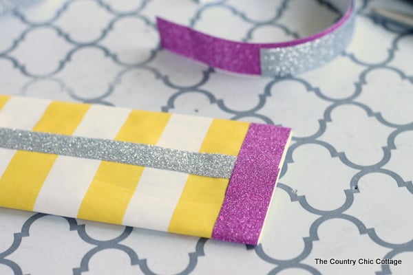 using washi tape to make this pencil bag project the right size.