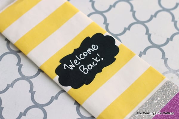 "welcome back" message on chalkboard label