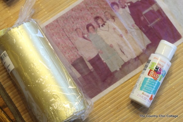 Gold candle with family photo and glue