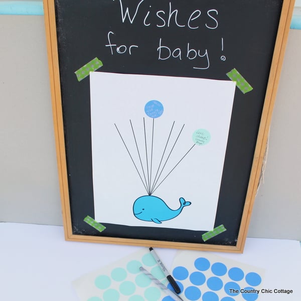 Baby shower guest book idea with free printable whale art!  Turn this fun guest book into art for baby's nursery after the shower!