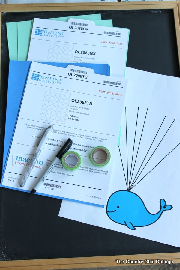 Baby shower guest book idea with free printable whale art!  Turn this fun guest book into art for baby's nursery after the shower!