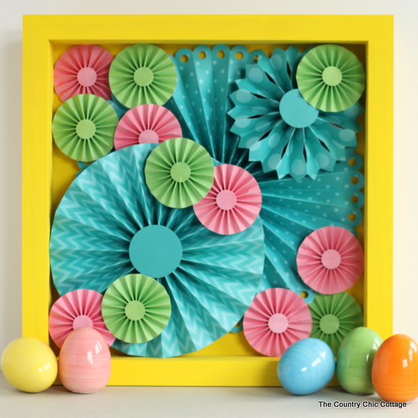 Make this rosette shadowbox art for your home!  Super easy to make with a rosette craft kit!