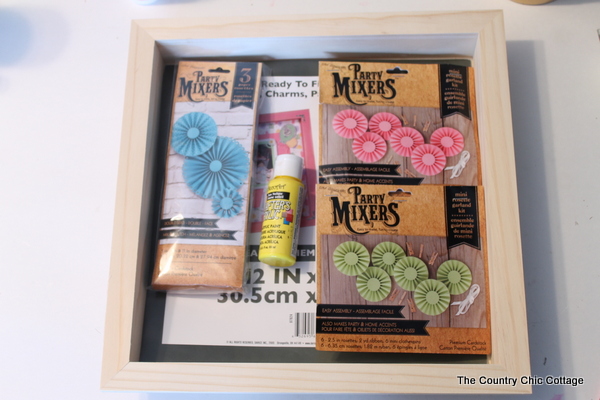 Make this rosette shadowbox art for your home!  Super easy to make with a rosette craft kit!