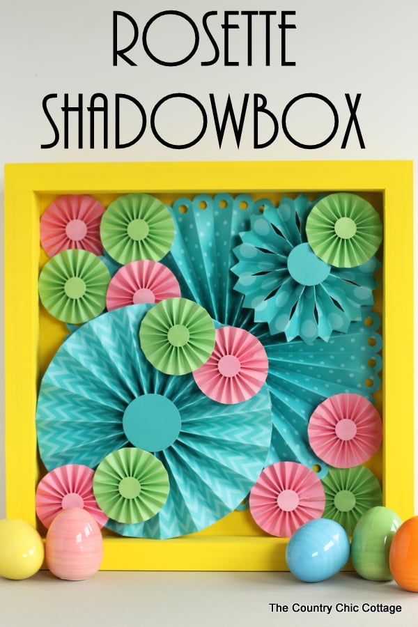 Make this rosette shadowbox art for your home!  Super easy to make with a rosette craft kit!