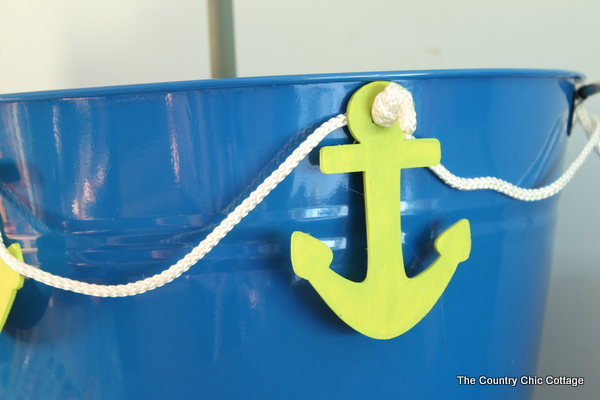 blue bucket with green anchors and rope for decoration