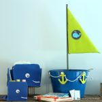Nautical baby shower decor - make this boat for collecting cards or books during the shower. Comes with a printable insert to ask guests to bring books instead of cards.