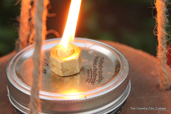 Wood and mason jar tiki torches -- tackle this outdoor project for a fun addition to any outdoor area! Get the step by step instructions here!