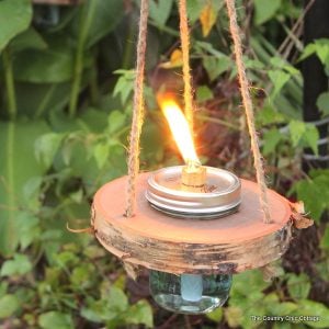 Wood and mason jar tiki torches -- tackle this outdoor project for a fun addition to any outdoor area! Get the step by step instructions here!