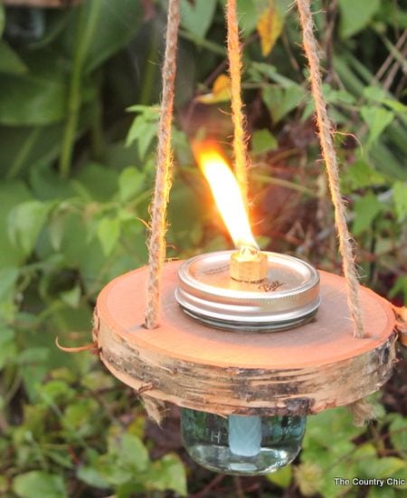 Wood and mason jar tiki torches -- tackle this outdoor project for a fun addition to any outdoor area! Get the step by step instructions here!