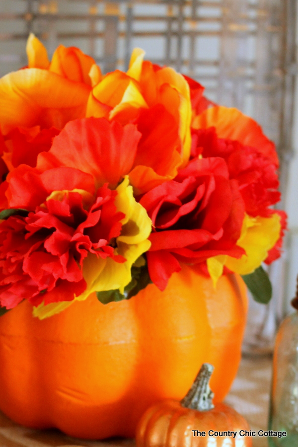 Make this dollar store flower pumpkin in just minutes with a few dollars worth of supplies!