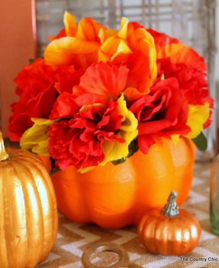 Make this dollar store flower pumpkin in just minutes with a few dollars worth of supplies!