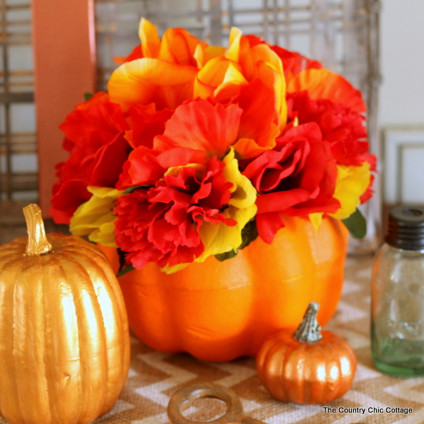Make this dollar store flower pumpkin in just minutes with a few dollars worth of supplies!