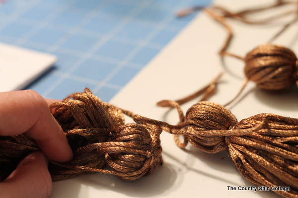 Make this yarn tassel garland for your home by following these step by step instructions!