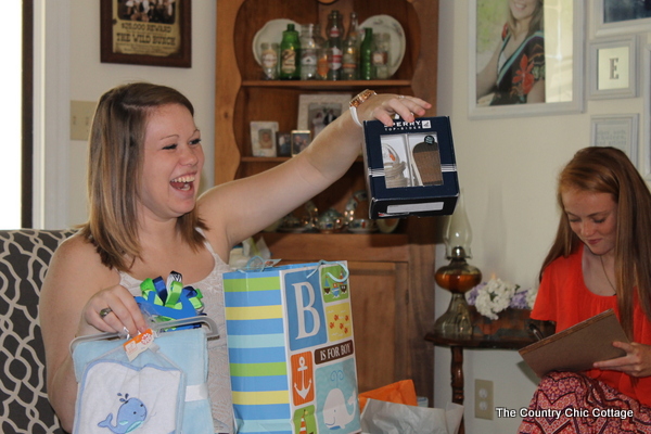 The mom to be enjoying gifts and company at her Nautical Themed Baby Shower