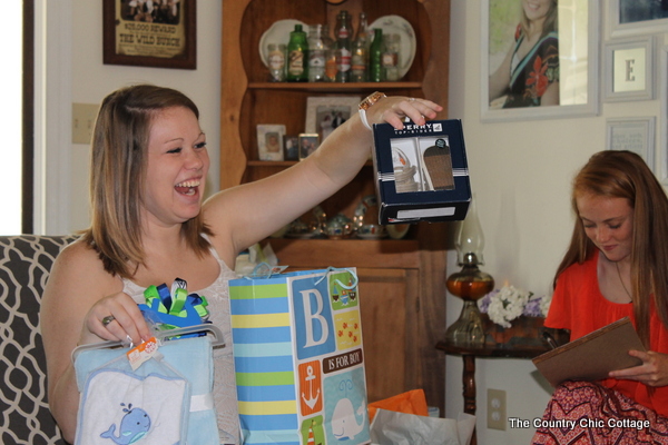 The mom to be enjoying gifts and company at her Nautical Themed Baby Shower!