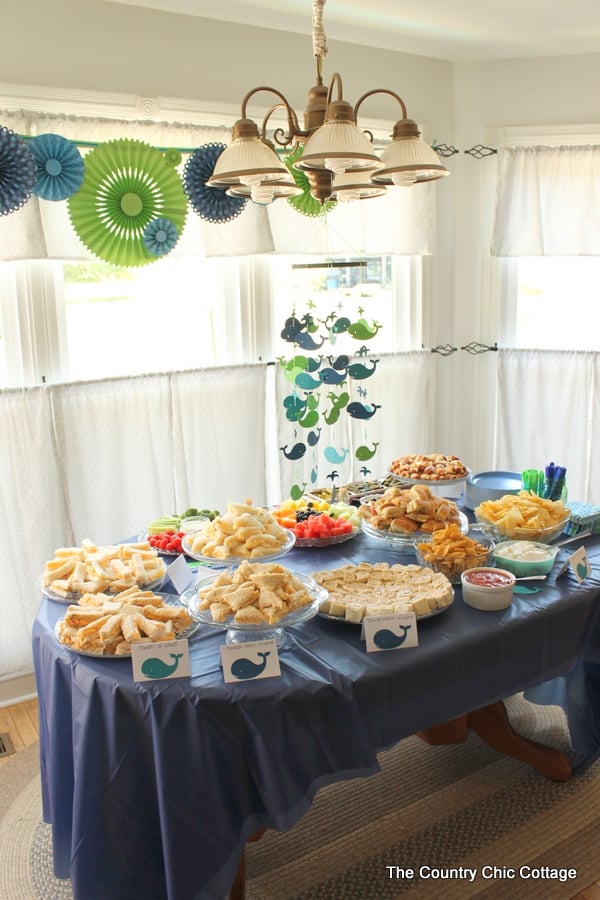 Our Nautical Themed Baby Shower had an appetizer table with a whale mobile hanging above