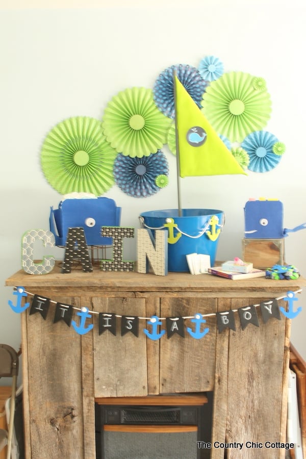 The gift table at the Nautical Themed Baby Shower has a fun baby banner and whale card holder