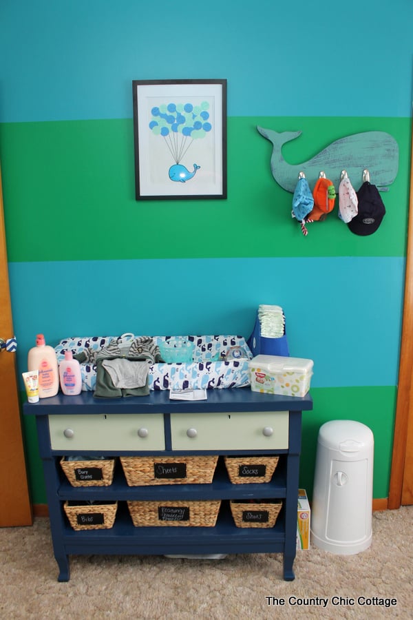 Turn a dresser into a changing table and more ideas in this nautical themed nursery!