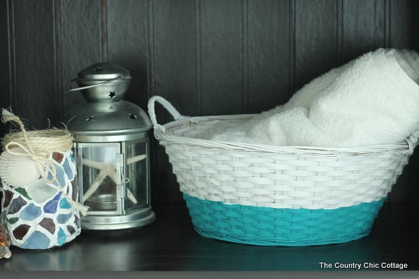 white and blue basket with white towel