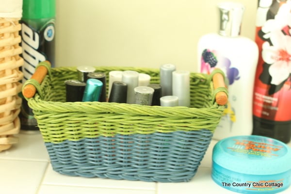 green and blue basket holding fingernail polish