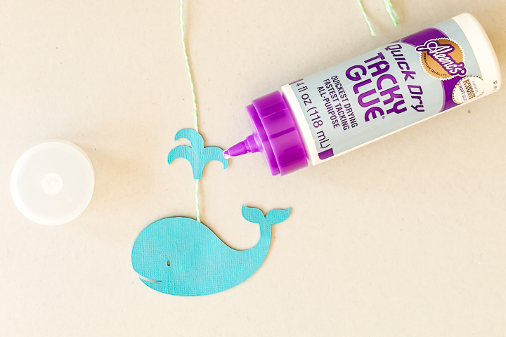 adding glue to paper whales