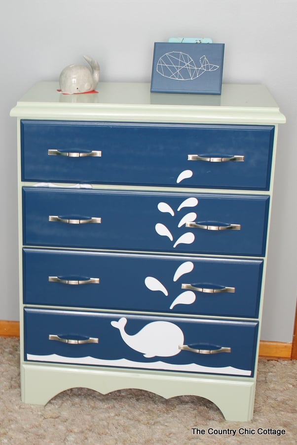 Turn a dresser into a changing table and more ideas in this nautical themed nursery!