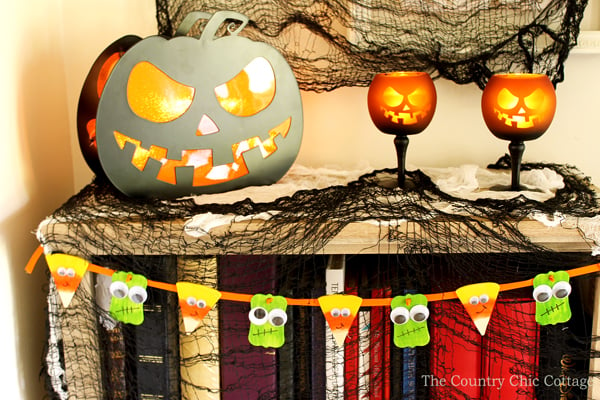 Cute DIY Halloween banner with little candy corn and monsters