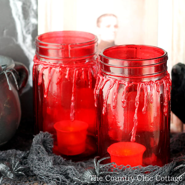 bloody mason jars with battery-operated candles inside