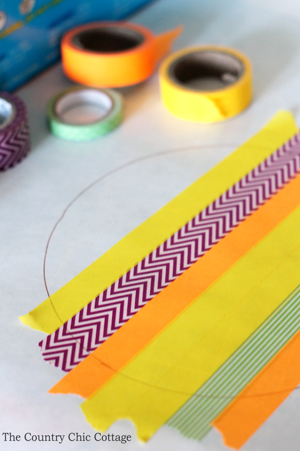 applying washi tape to freezer paper