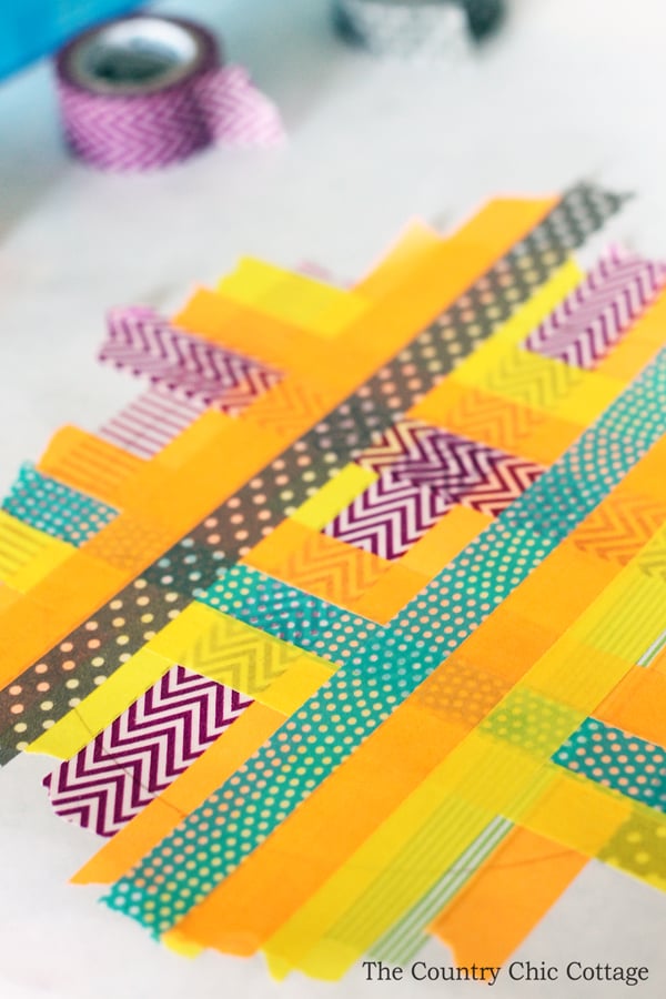 creating a pattern of washi tape on freezer paper