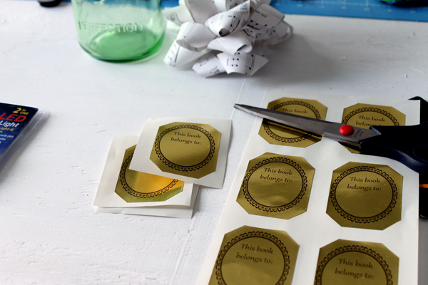 gold labels on white surface with scissors 